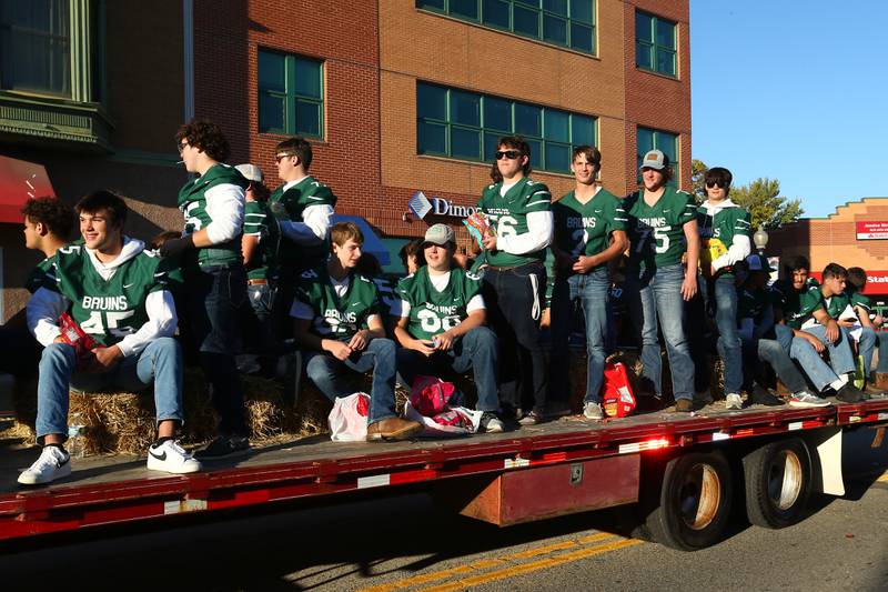 Members of the St. Bede football team ride in the Homecoming parade on Friday, Sept. 30, 2022 downtown Peru.