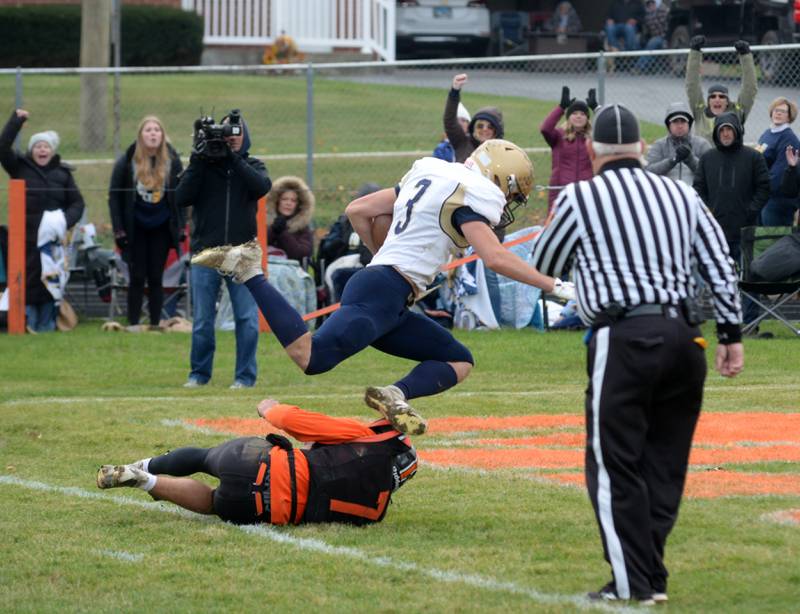 Polo's Damon Rowe (3) scores during 8-man playoff action against Milledgeville on Saturday, Nov. 16, 2024 at Milledgeville.