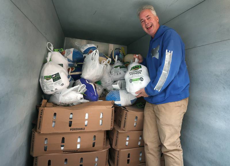 TD Ryan, host of the TD Ryan Unleashed podcast, with some of the donations collected during his Let’s Talk Turkey Thanksgiving food drive Friday, Nov. 21, 2025, at the Salvation Army food pantry in DeKalb.