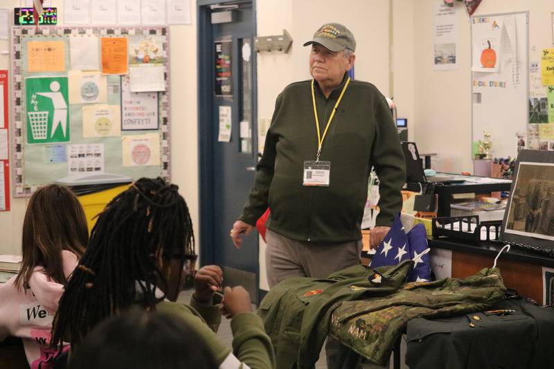 Edward Higgins, a Vietnam War veteran from Rockford, visits students on Monday, Nov. 10, 2025, in one of the classrooms at Clinton Rosette Middle School in DeKalb.
