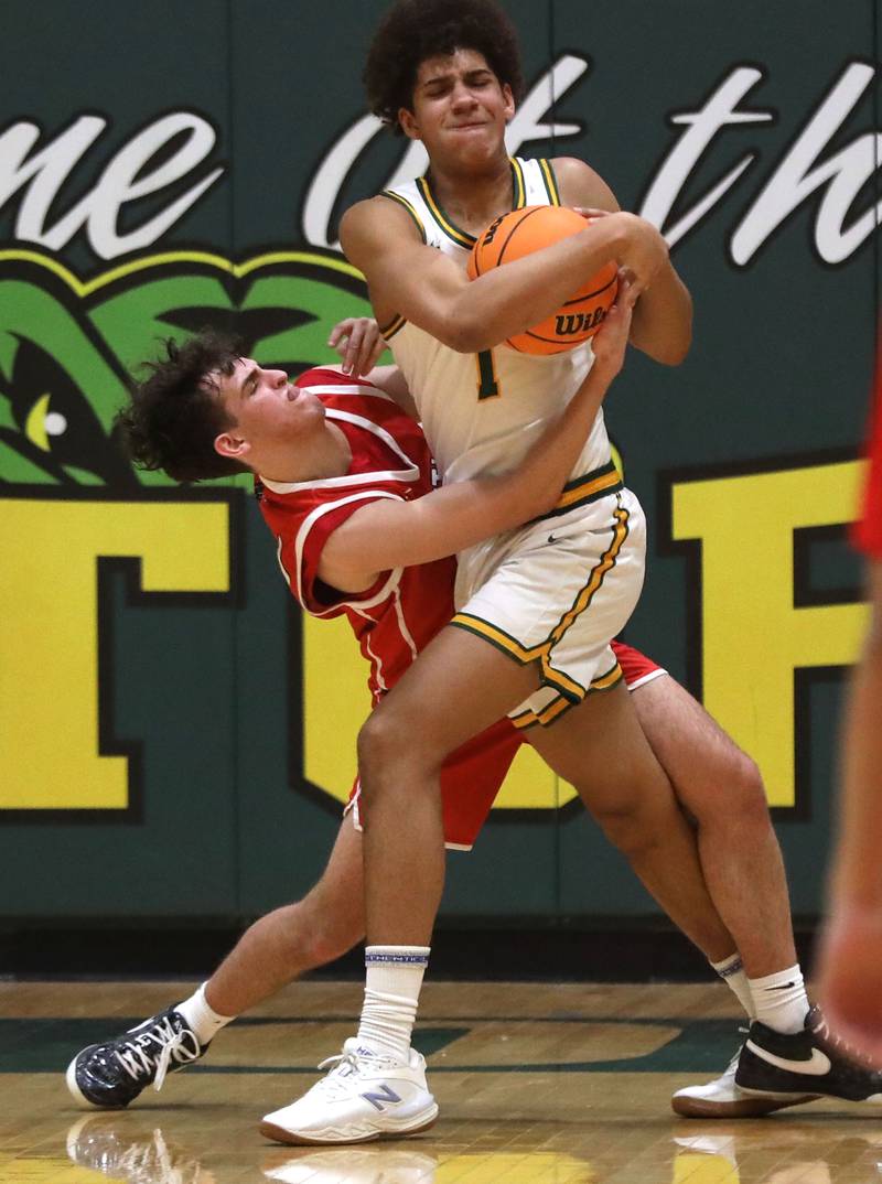 Huntley's Casey Kaczmarski battles with Crystal Lake South's Noah Cook for a rebound during a Fox Valley Conference boys basketball game on Friday, Jan. 30, 2026, at Crystal Lake South High School.