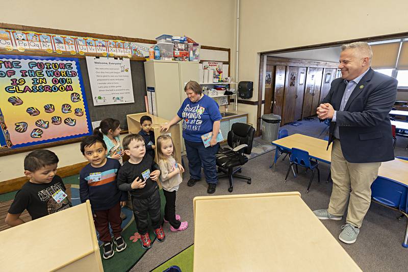 Congressman Eric Sorensen asks a group of Head Start preschoolers what they have been learning Wednesday, March 27, 2024 during a tour of the Sterling Wallace School.