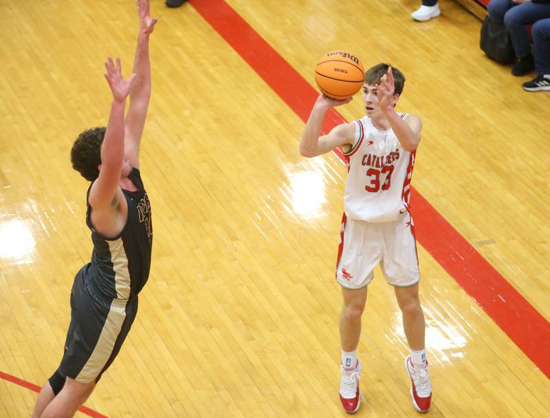 L-P's Gavin Stokes shoots a jump shot over Morris's Cade Laudeman on Monday, Feb. 9, 2026 in Sellett Gymnasium at L-P High School.