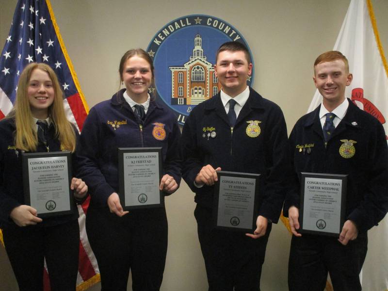 These Newark High School students earned the Illinois Association Future Farmers of America State Degree. They are, from left, Jacquelin Harvey, KJ Friestad, Ty Steffen and Carter Westphal. They were honored by the Kendall County Board on Aug. 2, 2022. (Mark Foster -- mfoster@shawmedia.com)