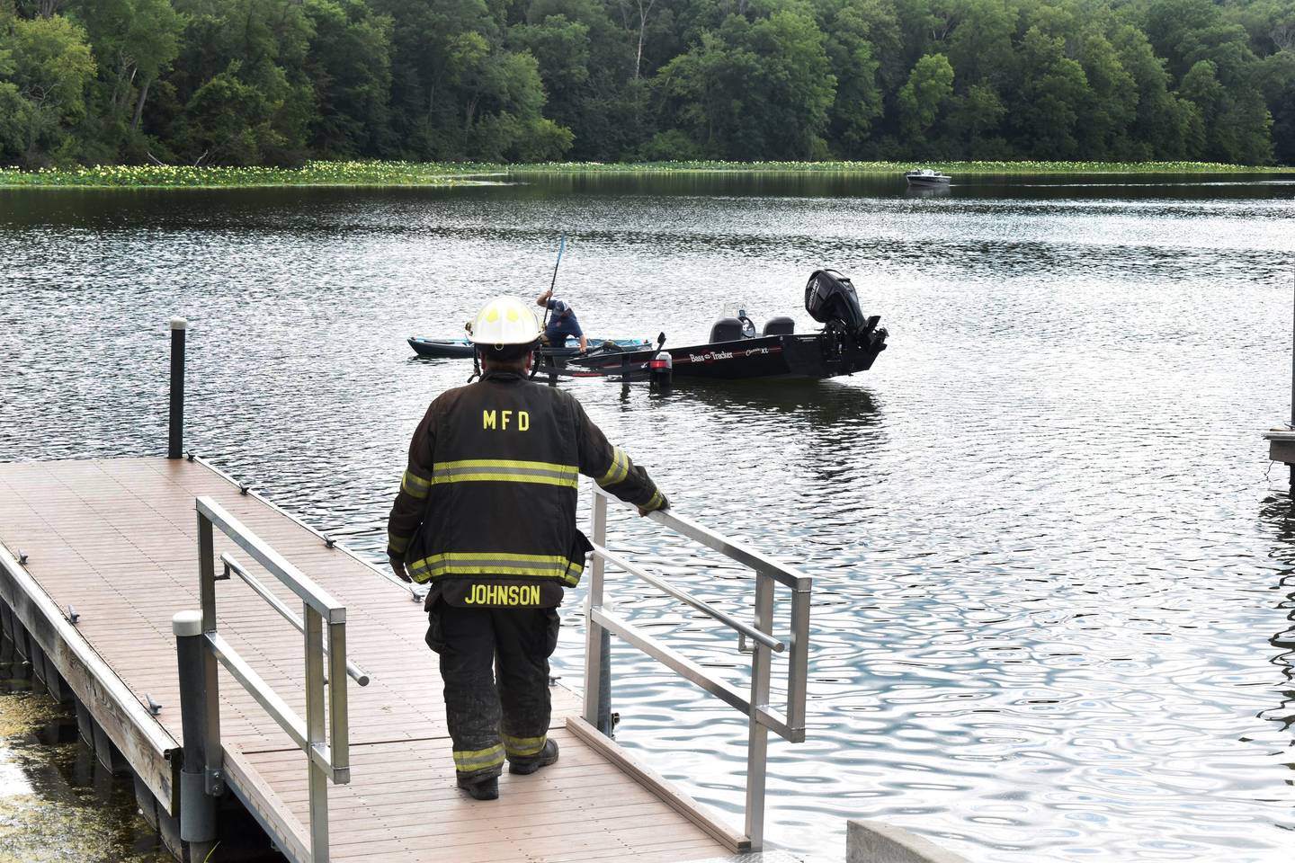 A Morrison firefighter watches as a truck, boat and trailer are recovered from the lake at Morrison Rockwood State Park near Morrison on Friday, July 18, 2025. No one was injured after the truck accidentally entered the lake at the boat ramp.