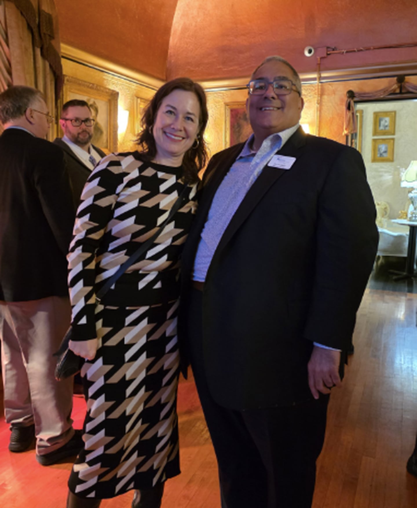 At the launch of the Kane County Circle of Care on Jan. 15, linking social service providers for at-risk families and youths, Heidi Mueller, director of the Illinois Department of Children and Family Services congratulates Jim Di Ciaula, executive director of CASA Kane County.