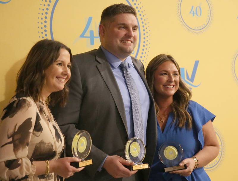 Megan Theisinger, Nick McLaughlin and Abigail Nambo pose for a photo with their awards during the 40 Under Forty awards banquet on Thursday, March 21, 2024 at Westclox in Peru.