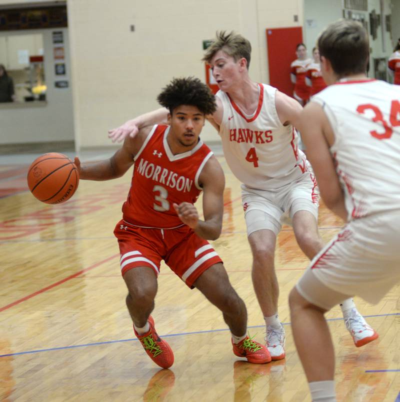 Morrison's DaeShaun McQueen (3) drives past Oregon's Jameson Caposey (4) during 2A regional action on Monday, Feb. 19, 2024 at the Blackhawk Center in Oregon. The Mustangs downed the Hawks 59-52 to advance to the Prophetstown Regional on Wednesday, Feb. 21.