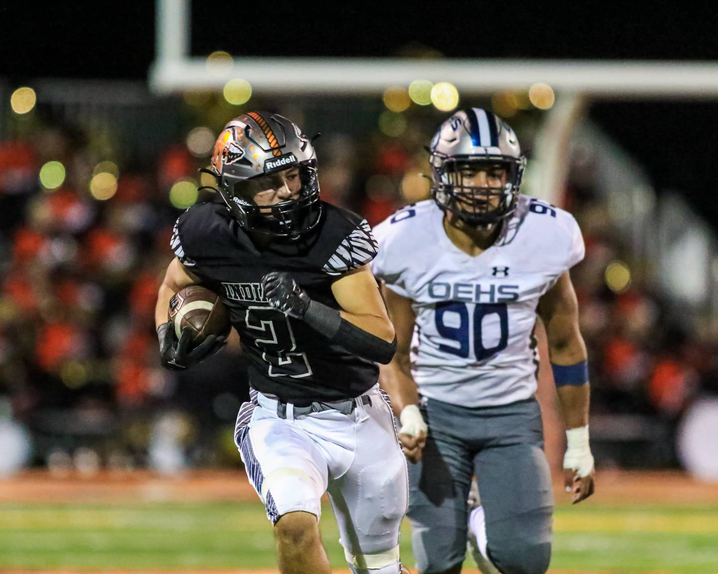 Minooka's Joey Partridge (2) takes off for a touchdown run during varsity football game between Oswego East at Minooka.  Sept 30, 2022