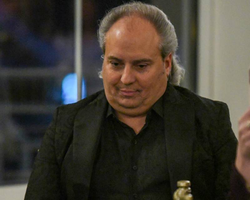 Ron Onesti, a 2025 Charlemagne award nominee, listens to his brother Rich Onesti speak about him during the St. Charles Area Chamber of Commerce Charlemagne Awards dinner on Friday, May 1, 2026, held at Royal Fox Country Club in St. Charles.