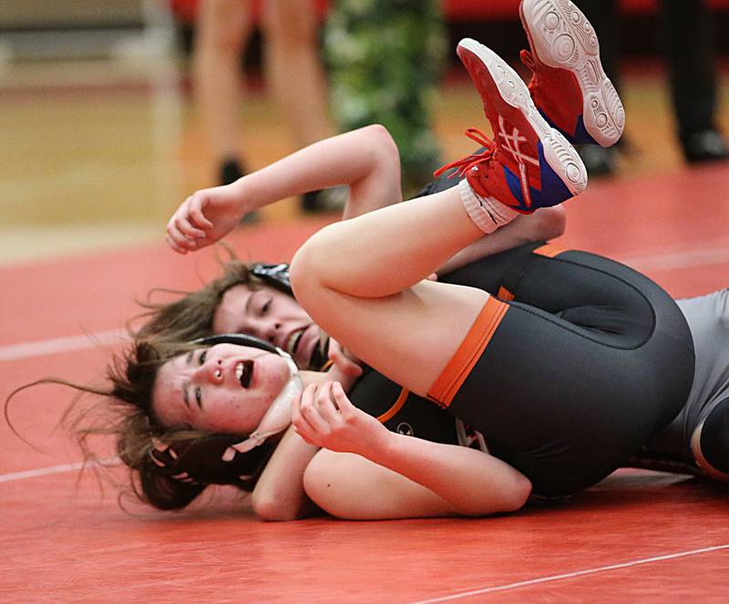 Ottawa's Dallas Harmon wrestles Sandwich's Ashlyn Strenz on Thursday, Jan. 12, 2023 in Kingman Gymnasium at Ottawa High School.