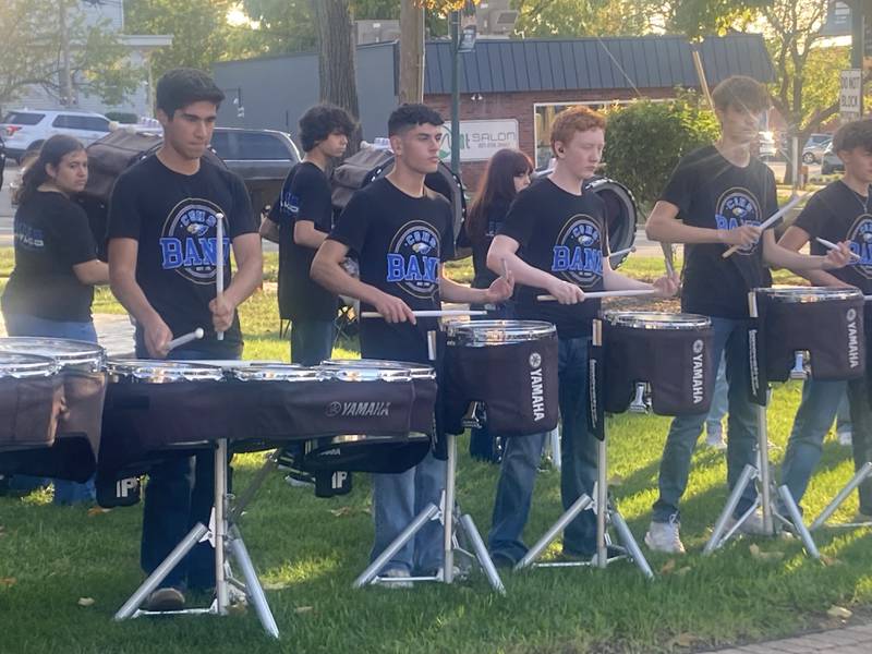 Members of the Carl Sandburg High School marching band drum line perform at the Let's Beat Breast Cancer rally in Lockport's Central Square. 
Thursday, Oct. 16, 2025.