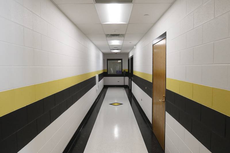 A new hallway on Wednesday, Jan. 26, 2022, at Harvard High School. The hallway is part of a $5.5 million renovation that added new locker rooms, a training room, wrestling room, and a weight and fitness area, along with repurposing the old locker rooms into staff, lounge and work rooms.