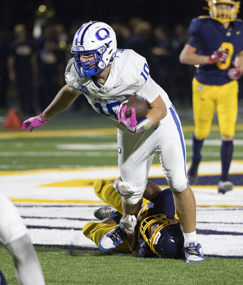 Sterling’s Alexander Zaragoza hauls down Quincy’s Noah Wells Friday, Oct. 17, 2025.