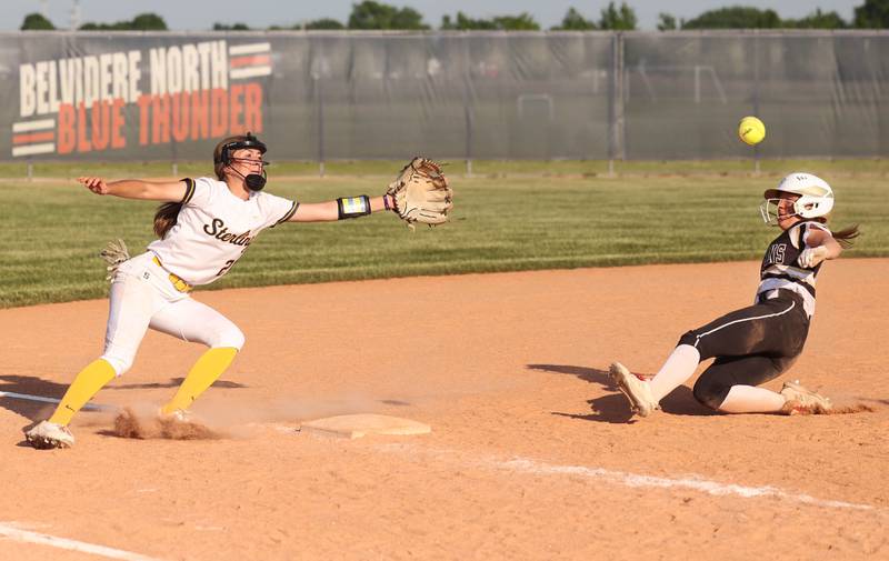 Sycamore's Addison McLaughlin advances to third in the bottom of the seventh as Sterling's Katie Taylor tries to catch the throw during their Class 3A sectional championship game Friday, June 2, 2023, at Belvidere North High School.