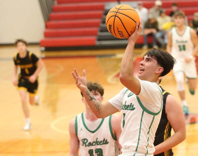 Rock Falls's Austin Castaneda eyes the hoop against Putnam County's AJ Furar during the 50th annual Colmone Classic on Monday, Dec. 9, 2024 at Hall High School.