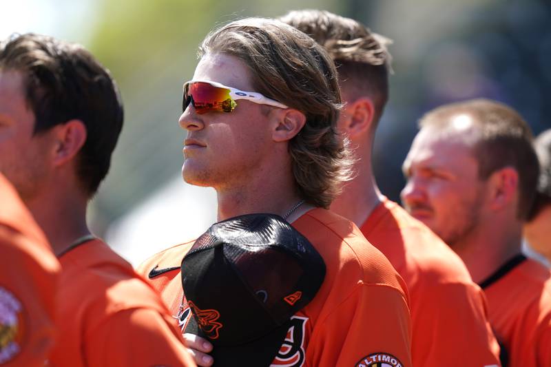 Baltimore Orioles infielder Rylan Bannon stands for the national anthem during a spring training game Pittsburgh Pirates on March 22, 2022, in Bradenton, Fla.