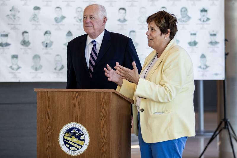 Jennifer Bertino-Tarrant, Will County Executive, introduces Former Governor Pat Quinn during the opening of the ‘Portrait of a Soldier’ exhibit at the Will County Courthouse in Joliet, Illinois on Sept. 11, 2025.