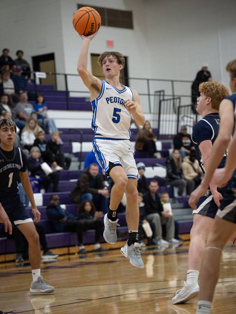 Peotone's Nate Wehrmann elevates for a shot against IC Catholic in the Thanksgiving tournament at Manteno High School on Monday, November 24, 2025.