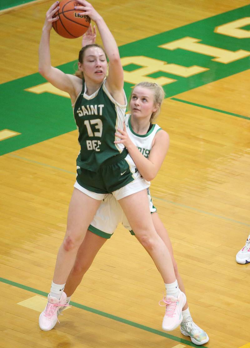 St. Bede's Ashlyn Ehm grabs a rebound over Seneca's Lainie Olson on Monday, Jan. 29, 2024 at Seneca High School.
