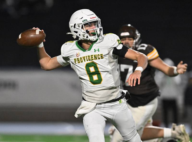 Providence Catholic's Tyler Payne (8) looks to pass the ball during the conference game against Joliet Catholic on Friday, OCT. 24, 2025, at Joliet.