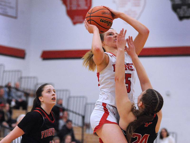 Benet's Lenee Beaumont (5) makes contact with Yorkville defender Ava Diqui (24) during the Girls' Class 4A Regional Final at Yorkville High School on Thursday, Feb. 16, 2023.