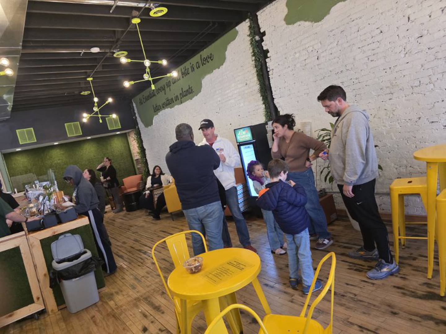 Customers gather in the new Essential Smoothies cafe located in the Majestic building in downtown Kankakee.