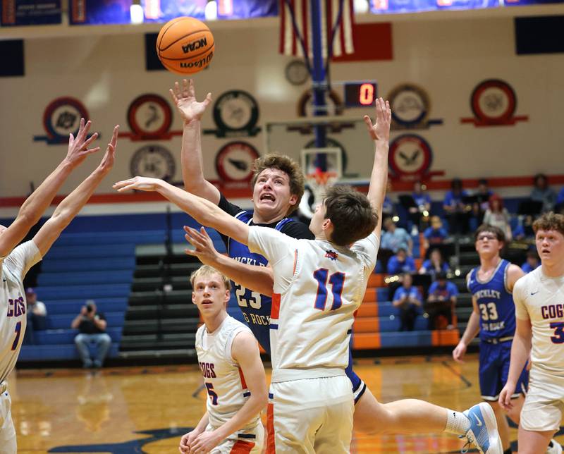 Hinckley-Big Rock's Luke Badal puts up a shot over Genoa-Kingston's Benjamin Kleba Tuesday, Jan. 6, 2026, during their game at Genoa-Kingston High School.