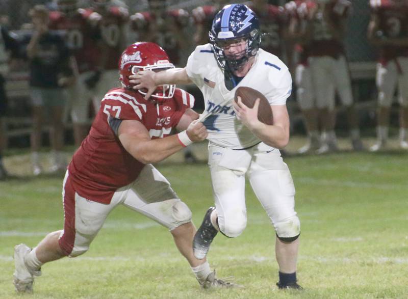 Bureau Valley quarterback Bryce Helms is chased down by Hall's Joel Koch on Friday, Sept 8, 2023 at Richard Nesti Stadium.