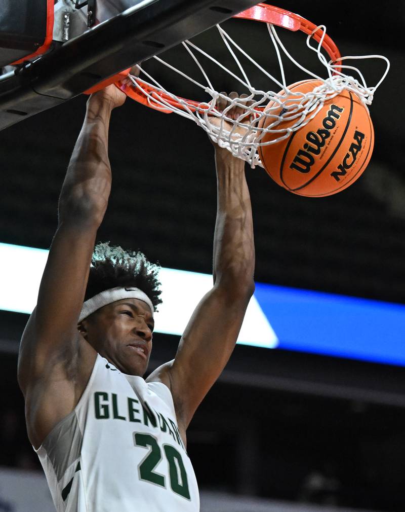 Glenbard West's Logan Glover dunks to bring the Hilltoppers within two of Evanston during the fourth quarter of the Class 4A boys supersectional game against Evanston at NOW Arena on Monday, March 10, 2025 in Hoffman Estates.