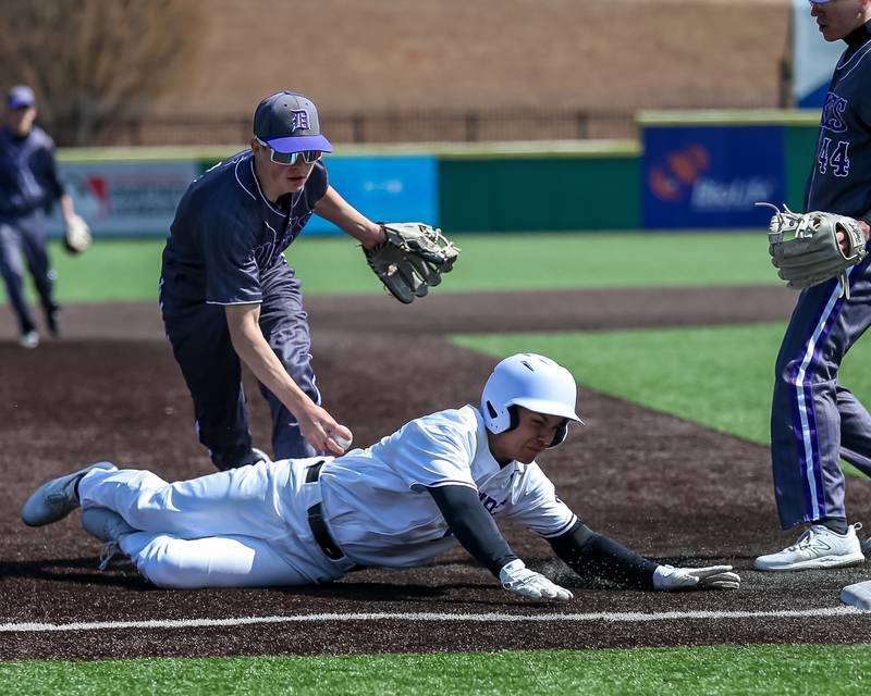 Hampshire's Jaryd Vence (5) is caught in a run down at third during baseball game between Dixon at Hampshire.  March 28, 2024