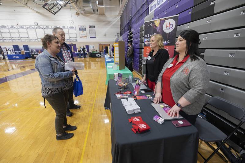 Kreider community service supervisor Brandy Muntean (left) chats with Hughes Resource’s Stepheni Chandler and Stephanie Richardson Wednesday, March 13, 2024 during Discover Dixon’s career fair at Dixon High School. Many local businesses and organizations set up booths to invite both students and the local public to gather information on jobs and careers in the area.