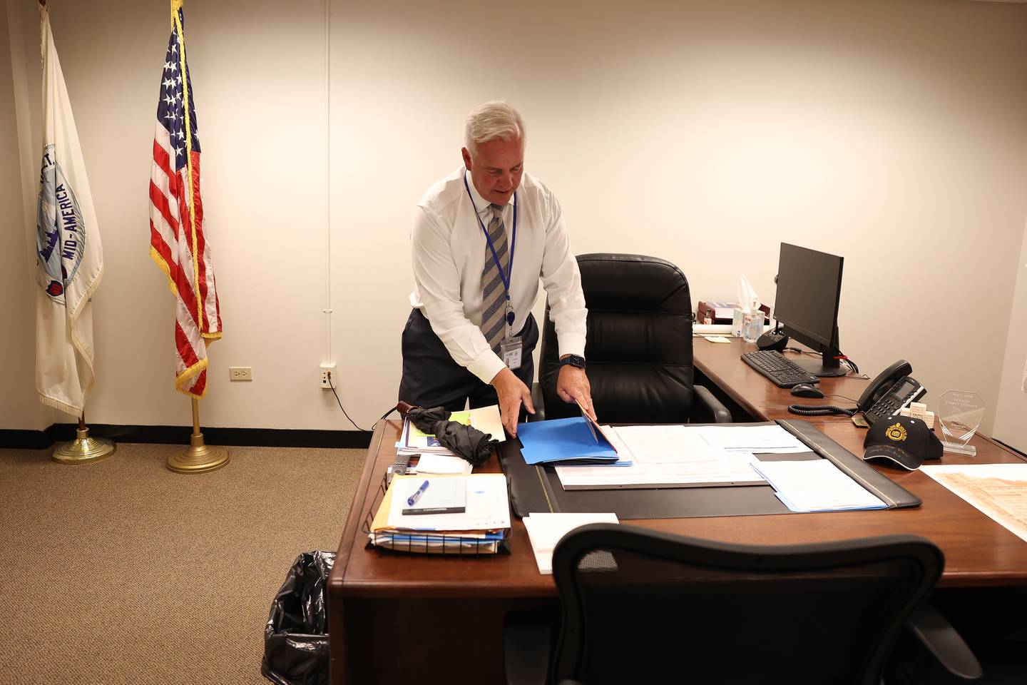 Mayor Terry D’Arcy gathers a folder off his desk in City Hall on Friday, Aug. 11, 2023 in Joliet.