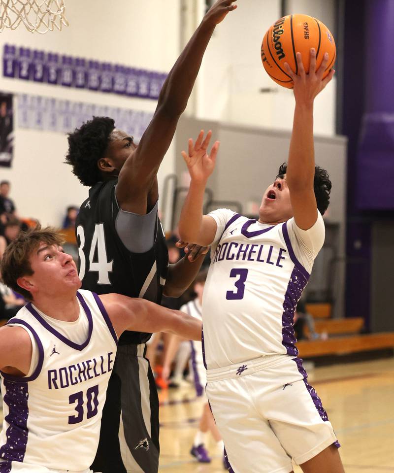 Rochelle's Kasin Avila tries to score over Kaneland's Jeffrey Hassan Tuesday, Feb. 3, 2026, during their game at Rochelle High School.