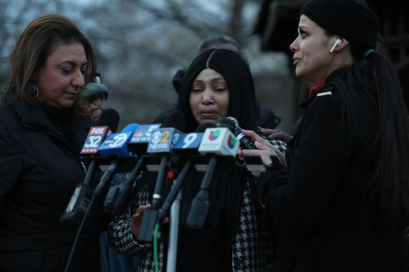 Bolingbrook Mayor Mary Alexander-Basta (left) stands with an emotional Tomika Reed, a relative of one of the victims, and Teresa Maritn at the candlelight vigil for the victims of the March 5th shooting on Wednesday, March 8th, 2023 in Bolingbrook.