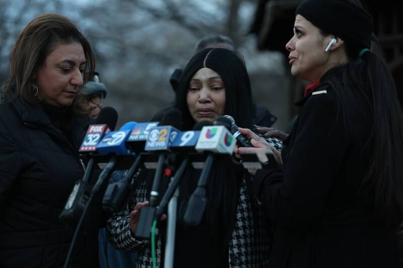 Bolingbrook Mayor Mary Alexander-Basta (left) stands with an emotional Tomika Reed, a relative of one of the victims, and Teresa Maritn at the candlelight vigil for the victims of the March 5th shooting on Wednesday, March 8th, 2023 in Bolingbrook.