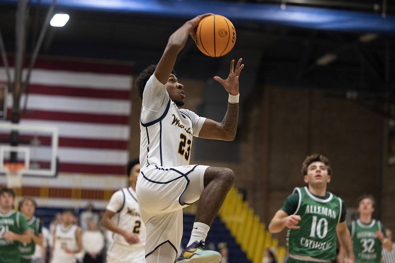 Sterling’s Kaedon Phillips goes up for two against Alleman Friday, Dec. 20, 2024, at Sterling High School.