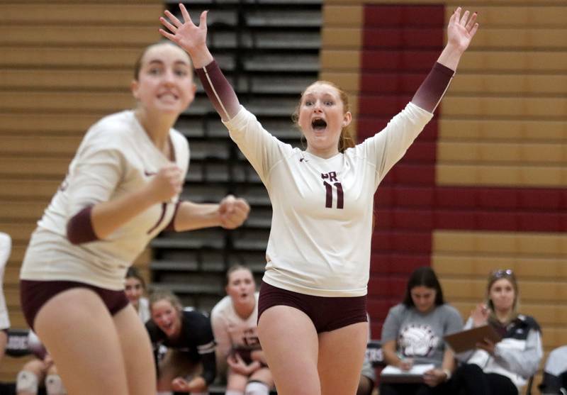Prairie Ridge’s Kaelin Bacak, right, and Quinn Bruggeman  celebrate a point in varsity girls volleyball at Huntley High School in Huntley on Thursday, Sept. 11, 2025.