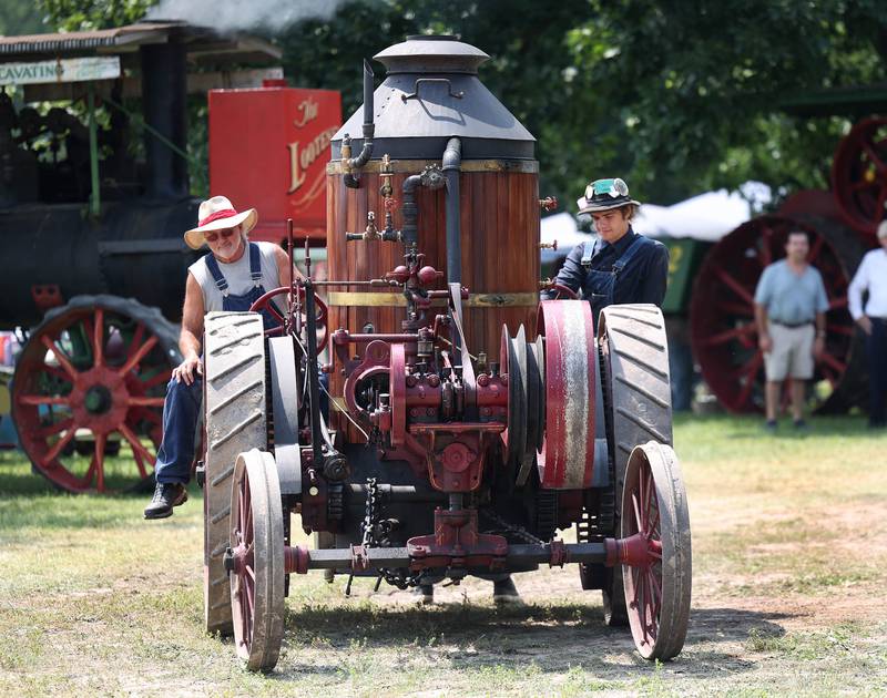 An 1884 Westinghouse makes its way down the path Thursday, Aug. 7, 2025, at the 68th annual Sycamore Steam Show and Threshing Bee at Taylor Marshall Farm on Lukens Road in Sycamore.