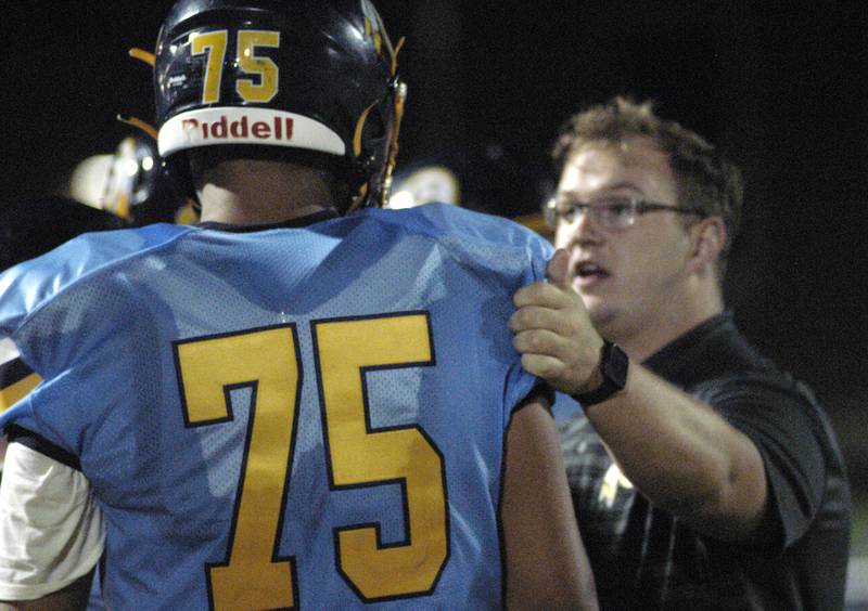 Assistant coach Ryan Heffelfinger talks with Angeles Coleman at Fridays game. Niles North traveled to Sterling High School to play the Warirors on Sept. 6, 2024