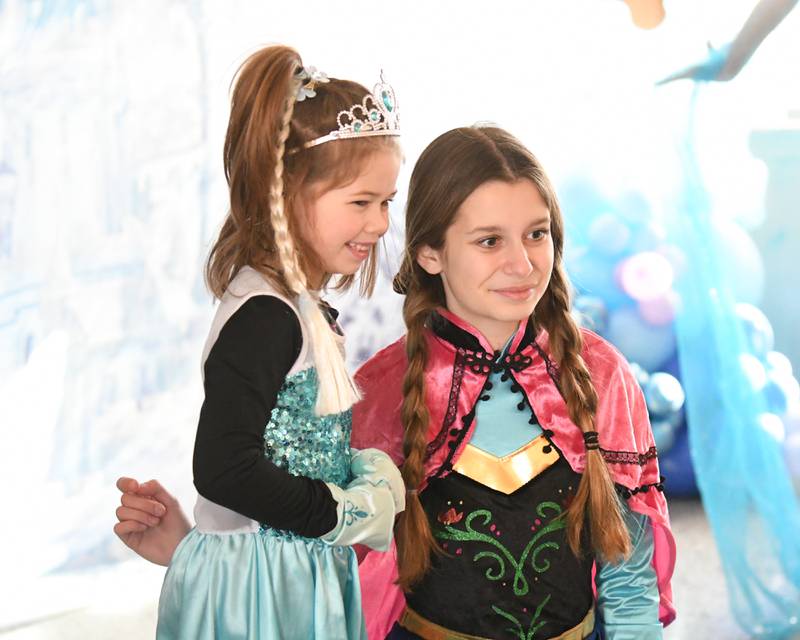 Erin Cavana, 6, of Glen Ellyn poses with Anna from Frozen during the Frozen event held at Lake Ellyn in Glen Ellyn on Saturday Jan. 20, 2024.