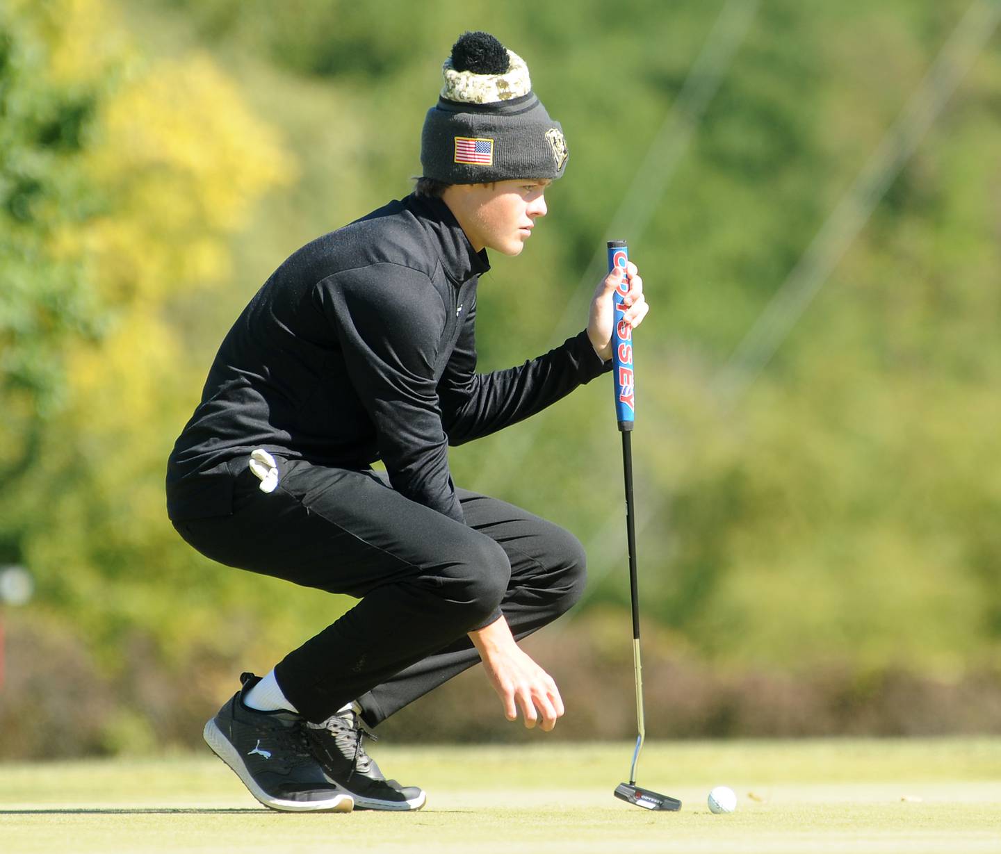 Oswego East's Connor Banks lines up a putt on the 7th green during the Class 3A Oswego Boys Golf Sectional at Blackberry Oaks Golf Course in Bristol on Monday, Oct. 3, 2022.