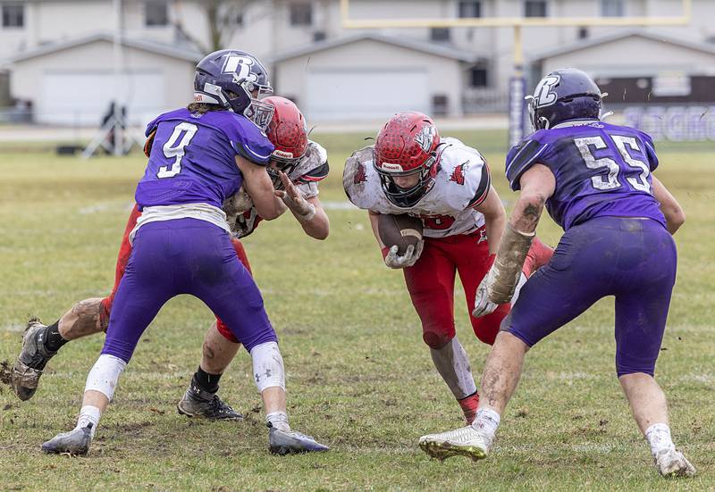 Fulton’s Lukas Schroeder picks up yards Saturday, Nov. 5, 2022 during a round two football playoff game against Rockford Lutheran.