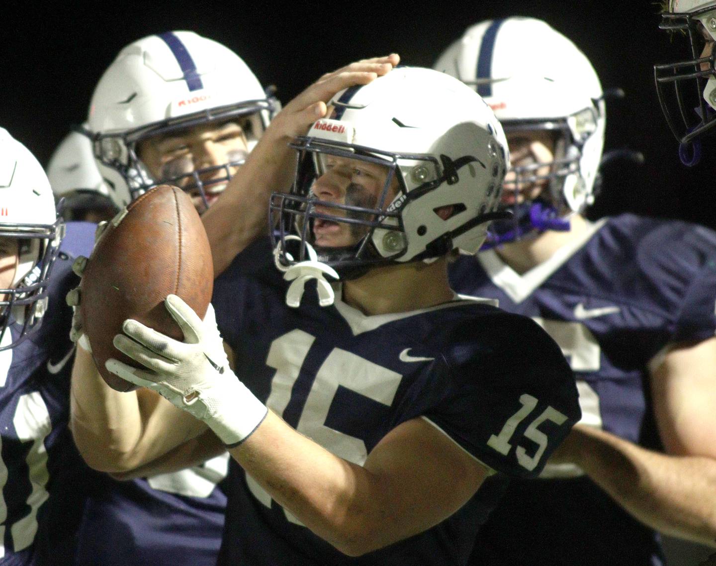 Cary-Grove’s Jake Hornok, center, is greeted in the end zone after scoring a touchdown against Libertyville  in first-round Class 6A playoff  football action at Cary Friday.