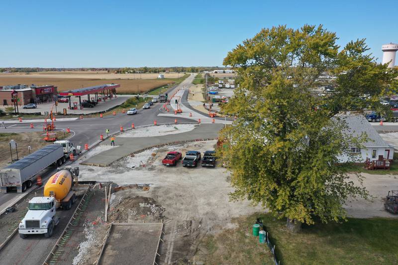 Workers pour concrete on the northeast corner of the roundabout at the intersection of Illinois 178 and U.S. Route 6 on Tuesday, Oct. 18, 2022 in Utica.