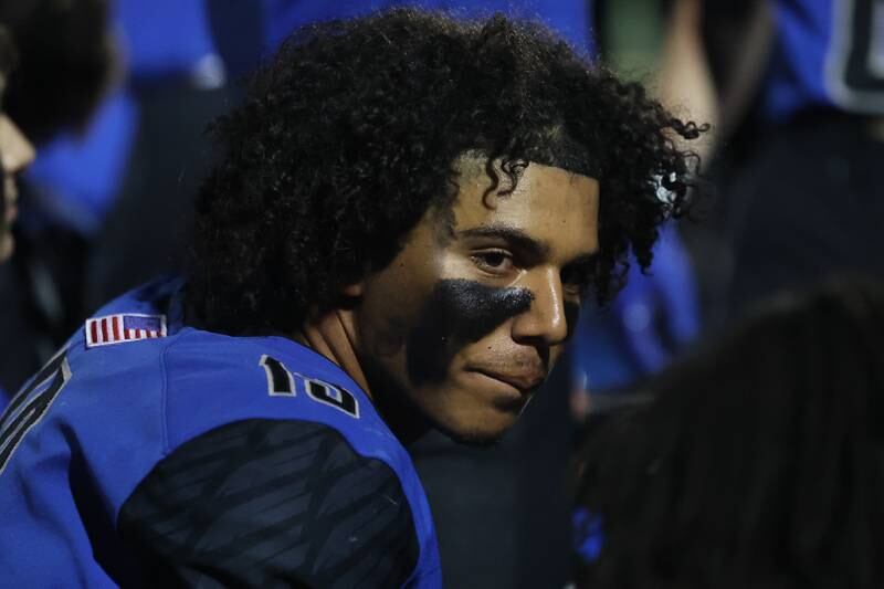 Lincoln-Way East’s Jonas Williams sits on the bench in the final minutes of their win against Naperville Central on Friday, Oct. 25, 2024 in Frankfort.