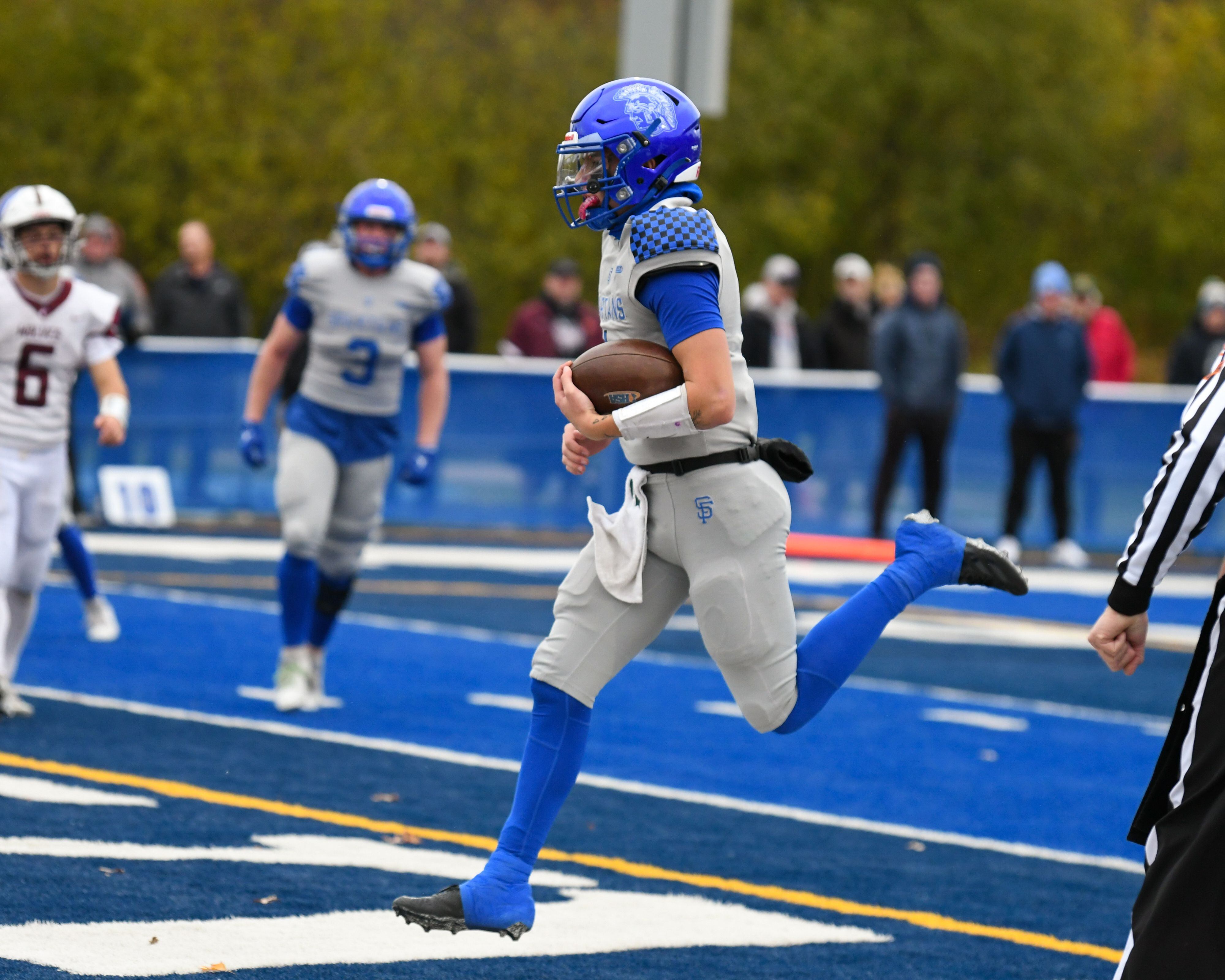 St. Francis's Brock Phillip (1) runs in for a touchdown during the second round of the 5A playoff game while taking on Prairie Ridge on Saturday Nov. 8, 2025, held at St. Francis's High School.