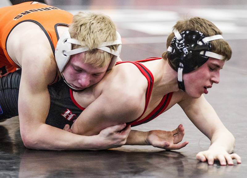 McHenry's Ian Mullen (left) wrestles Huntley's Zach Spencer during the 106-pound championship match of the 3A IHSA sectional Saturday, Feb. 14, 2015 at Barrington. Mullen won the match, 20-9.