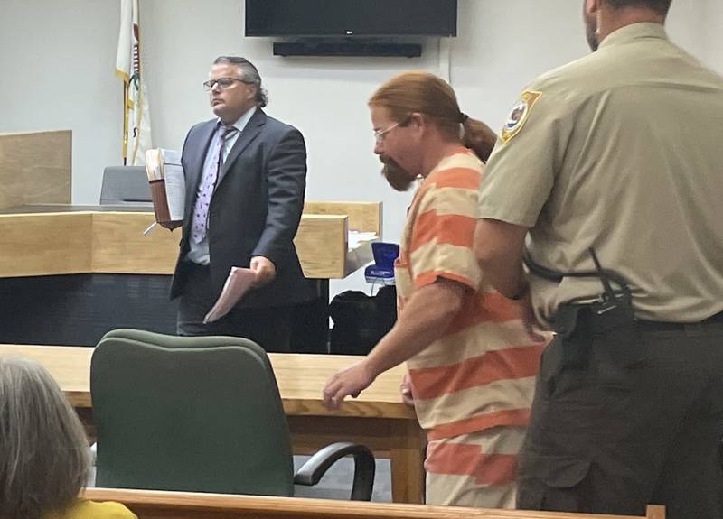 Ronald Martin Jr. is escorted into a courtroom on Friday, Aug. 1, 2025, at the La Salle County Government Complex in Ottawa. For now, the suspect in the July 17 shooting in rural Sheridan will stay in custody. Martin reserved the right to argue later for pre-trial release while his attorney plunges into the piles of evidence tendered by the prosecution.