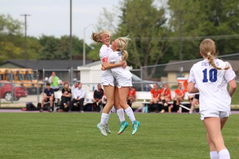 Peotone's Allie Werner, left, leaps in the air with teammate Peyton Bisping in celebration of Werner's tying goal in the first half during Peotone's 2-1 victory over Beecher in the Class 1A Manteno Regional championship on Friday, May 22, 2026.